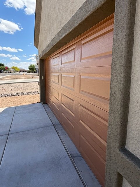 Painted garage door on stucco home