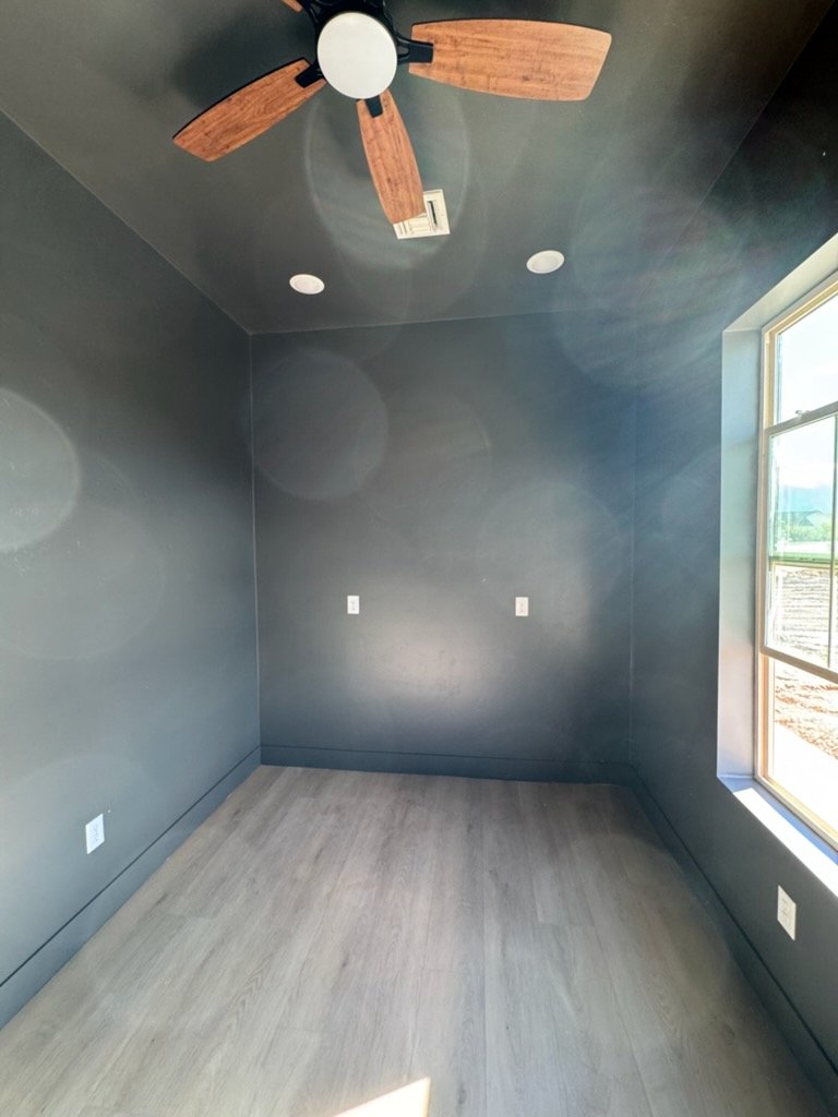 Navy blue painted bedroom