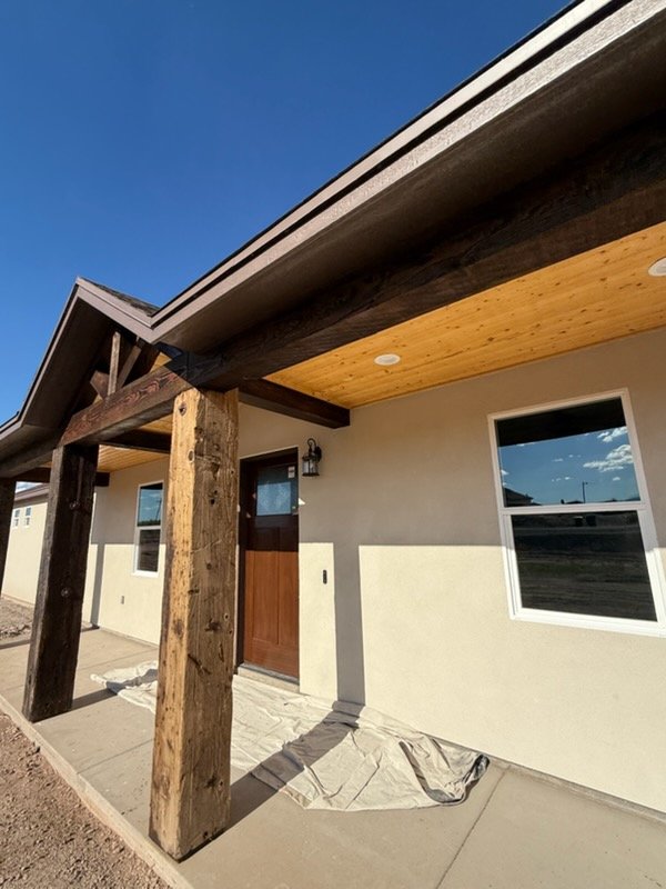 Stained wood porch ceiling and posts